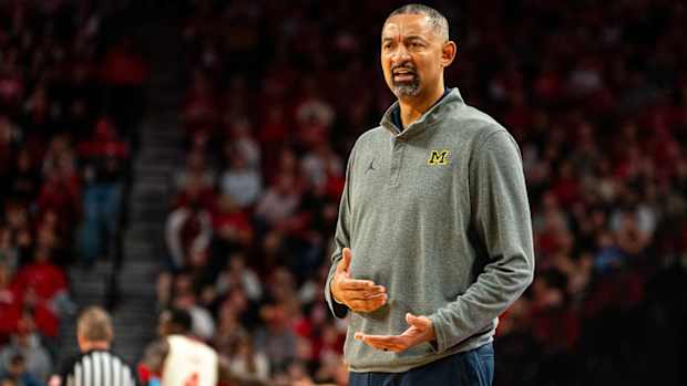 Juwan Howard coaches Michigan from the bench.